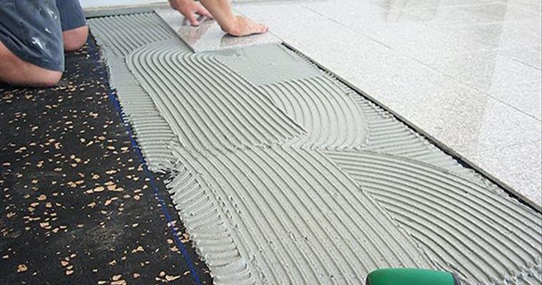 AcoustaMat acoustic underlay installation under tiles