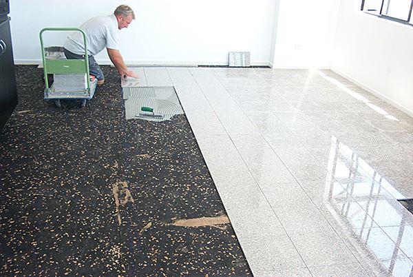 Aoucstamat being laid on floor